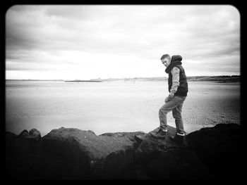 Woman standing on beach