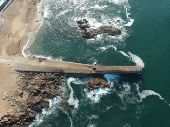 High angle view of rock in sea