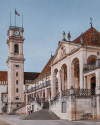 Clock tower in old town against sky