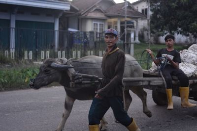 Portrait of man riding horse