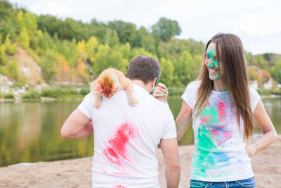 Friends standing against blurred background