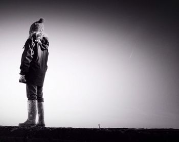 Close-up of woman standing in the dark