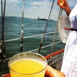 Cropped image of woman holding boat