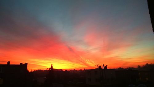 Silhouette of built structures at sunset