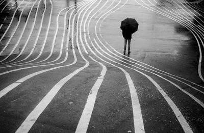 High angle view of people walking on road