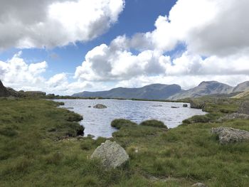 Scenic view of lake and mountains against sky