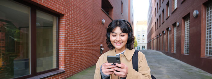 Young woman using mobile phone