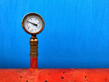 Close-up of information sign on wall