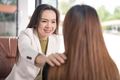 Portrait of a smiling young woman