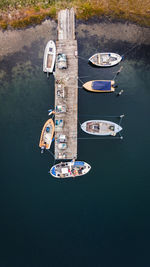 Aerial view of sailboats moored in lake