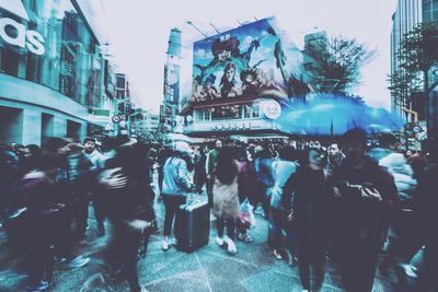 People walking on street in city