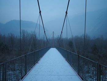 Footbridge against sky