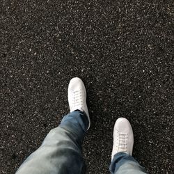 Low section of man standing on floor