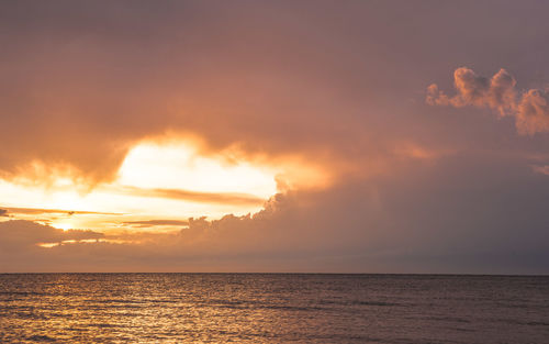 Scenic view of sea at sunset