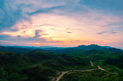 Scenic view of mountains against sky during sunset