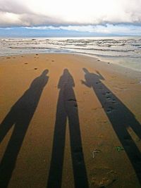 Shadow of people on beach