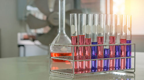 Close-up of chemical in laboratory glassware on table