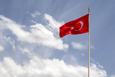 Low angle view of flag against sky