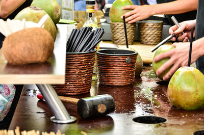 Close-up of people preparing drinks