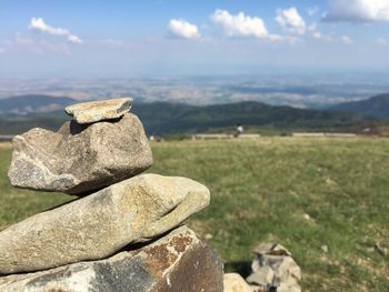 View of rocks on land against sky