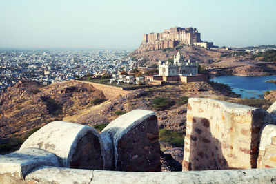 Mid distant view of mehrangarh fort and jaswant thada against clear sky