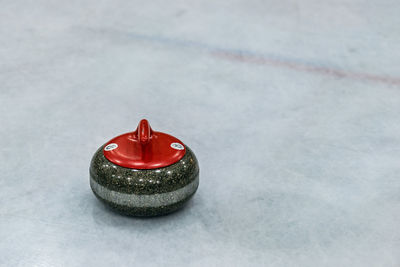 Close-up of curling stone on ice rink