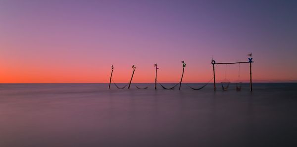 Scenic view of sea against clear sky during sunset