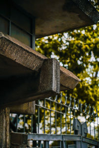 Low angle view of roof against trees