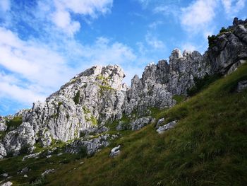 Low angle view of rocks against sky