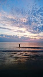 Scenic view of sea against sky at sunset