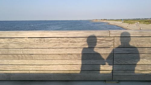 Shadow of people on beach