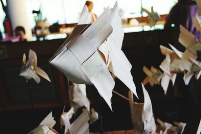 Close-up of paper hanging on table
