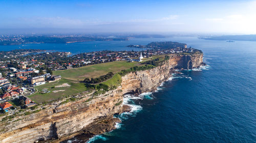 High angle view of sea and buildings against sky