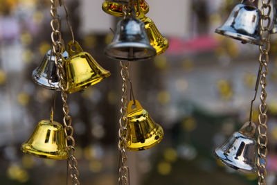 Close-up of bells for sale at market stall