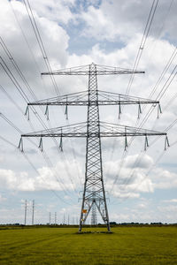 Expansion of the high-voltage grid with many high-voltage pylons to meet the  demand for electricity