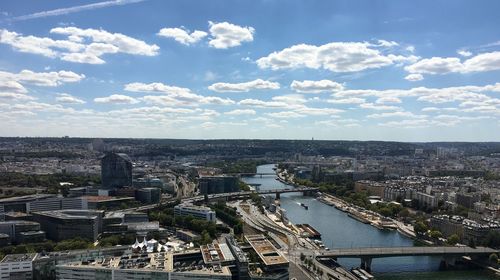 Aerial view of river and buildings against sky in paris 