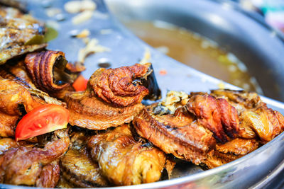 Close-up of meat on barbecue grill