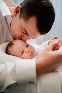 Close-up of baby girl with hands