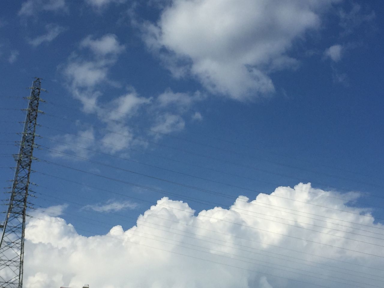 low angle view, sky, cloud - sky, power line, blue, cable, electricity, cloudy, cloud, power supply, connection, electricity pylon, nature, no people, day, outdoors, technology, beauty in nature, fuel and power generation, tranquility