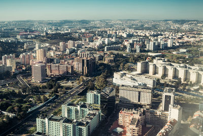 High angle view of modern buildings in city against sky