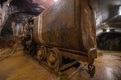 Old rusty wheel in abandoned building