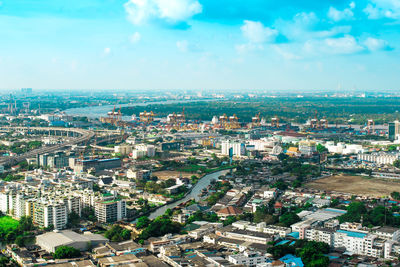 High angle view of buildings in city against sky