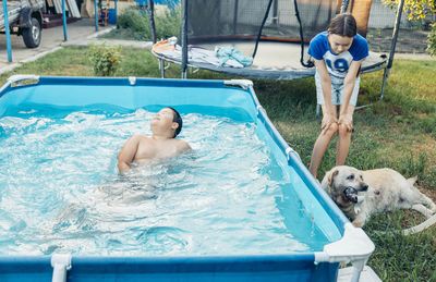 Rear view of woman in swimming pool