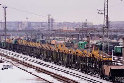 Train on railroad tracks against sky