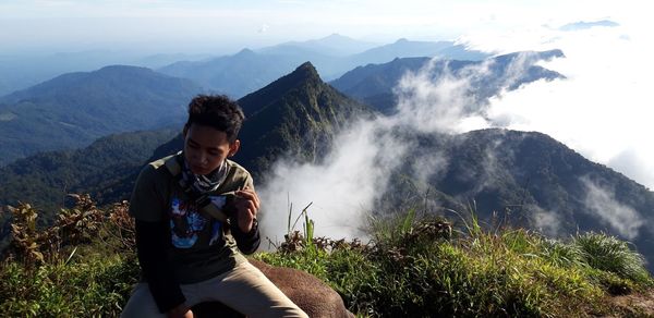 Full length of young man against mountains