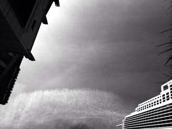 Low angle view of building against cloudy sky