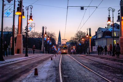 Tram on street along buildings