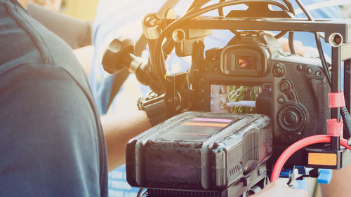 Rear view of man by camera