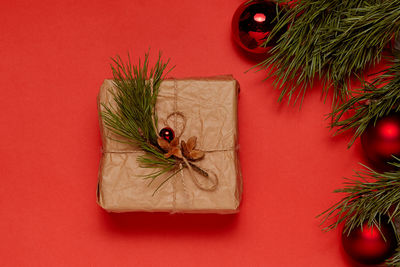 Directly above shot of christmas decorations on red background