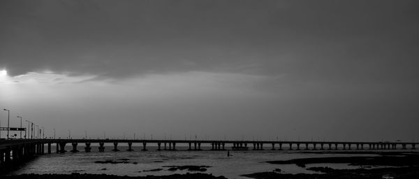 Bridge over sea against sky